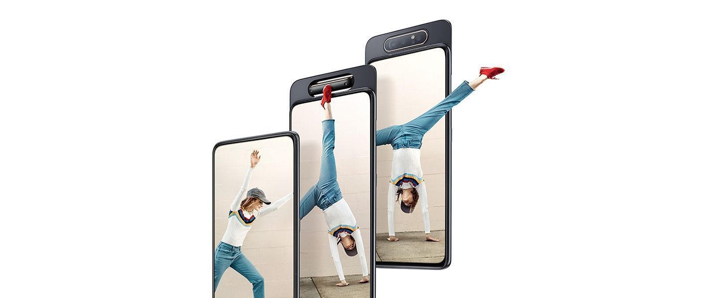 Woman does cartwheel out of Galaxy A80 to show how the smartphone brings content to life.
